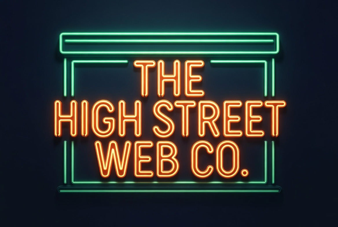 A neon sign displaying 'THE HIGH STREET WEB CO.' in glowing orange letters, framed by a teal neon border, set against a dark background suggesting a local but modern shop front offering web and other digital services to small and medium sized enterprises and businesses